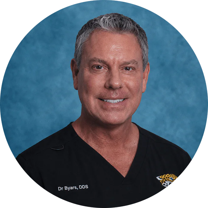 Dr. Byars is a dedicated professional, with over 25 years of experience in his field. He has an impressive career path and has helped people smile again all over the world. He earned his Doctor of Dental Surgery Degree in 1998 from the University of Detroit Mercy School of Dentistry, following his undergraduate studies from Olivet College. After graduation, he was commissioned as an officer in the United States Navy. Proudly he served our country for 12 years, completing his service at the rank of Commander in 2014 at MacDill Airforce Base in Tampa, Florida. Throughout his military career Dr. Byars continued his education, completing a yearlong fellowship in oral surgery. While stationed in Sicily, Italy and Bahrain he provided families with their surgical and general dental care.