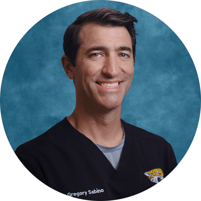 Dr. Gregory J. Sabino has been serving the people of Jacksonville for almost a decade. His practice focuses on digital workflows for prosthodontics and cosmetic dentistry. He prioritizes patient outcomes by combining advanced clinical skills with a strong foundation in biomedical science to deliver precise, evidence-based care. A graduate of Northwestern University, he earned his Doctor of Dental Surgery from Stony Brook University School of Dental Medicine and completed a General Practice Residency at the Northport VA Medical Center, gaining extensive experience in full mouth rehabilitation. Prior to dentistry, he completed a Ph.D. in Molecular and Cellular Biology where he published on the links between periodontal disease and heart disease. Dr. Sabino served on the American Dental Association Scientific Expert Panel charged with developing clinical practice guidelines for restorative care. An avid writer, he has authored and co-authored many dental articles and research publications in peer-reviewed journals such as the American Journal of Pathology and Journal of Immunology. He has lectured nationally for the ADA and American Student Dental Association on evidence-based dentistry, CAD/CAM techniques, and professional issues. His patients benefit from a clinician who integrates rigorous scientific training with practical expertise in complex restorative and surgical care.